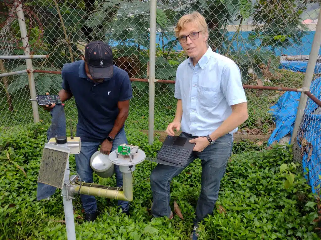 JBA's Murray Dale working in Sierra Leone on a hydromet installation, showcasing JBA’s expertise in flood forecasting and early warning systems | JBA Global Resilience.