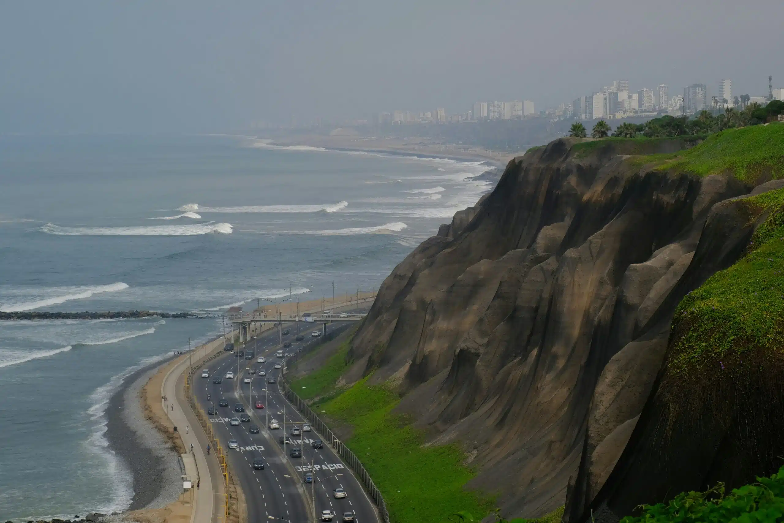 Coastal cliffs and highway in Lima, Peru, showing urban development and exposure to coastal flood and erosion risk.